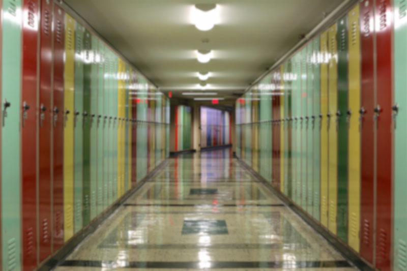 A hallway with lockers in a school